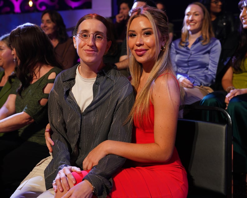 Gabby Windey and Robby Hoffman pose together at an awards show.